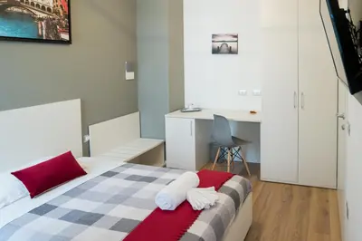 Letto o letti in una camera di Venice Rooms