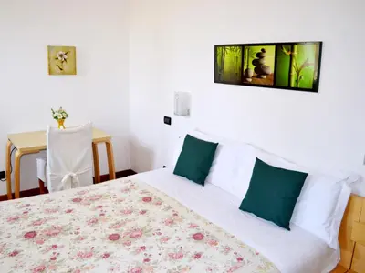 Letto o letti in una camera di La Noghera