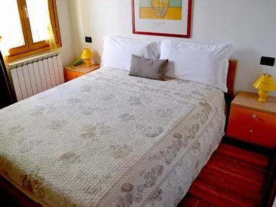 Letto o letti in una camera di La Noghera