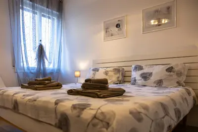 Letto o letti in una camera di ANGELA GUEST HOUSE in centro storico