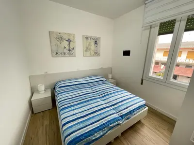 Letto o letti in una camera di CONDOMINIO ROSA- WALTERIGATO APARTMENTS-SOLO PER FAMIGLIE
