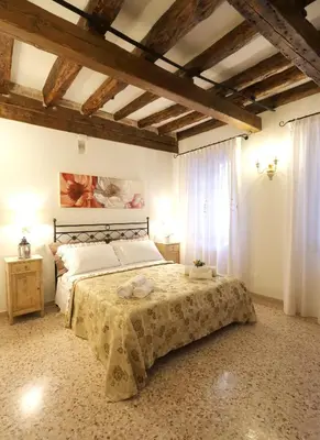 Letto o letti in una camera di Ca' del Pittor Apartments