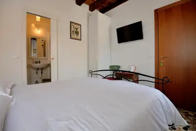 Letto o letti in una camera di Casa dea corte apartment