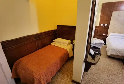 Letto o letti in una camera di Palazzo Eugenia - Minelli