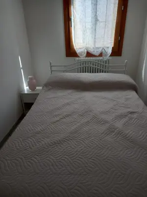 Letto o letti in una camera di Casa Alice