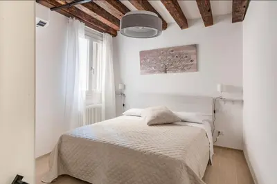 Letto o letti in una camera di Palazzina San Polo 2151