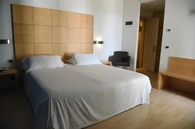 Letto o letti in una camera di HOTEL DUCA D'AOSTA