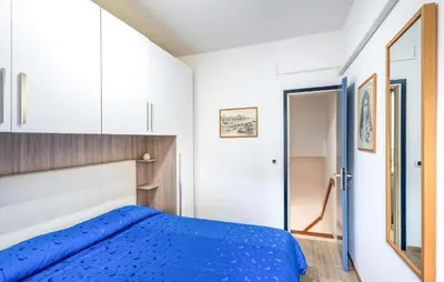 Letto o letti in una camera di Perla