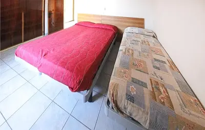 Letto o letti in una camera di Lovely Apartment In Rosolina Mare