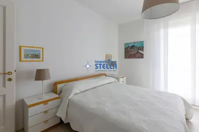 Letto o letti in una camera di Condomino Marina Marconi