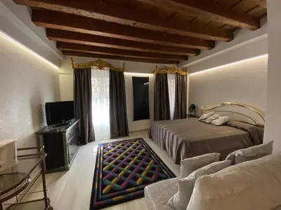 Letto o letti in una camera di LN HOMES VENICE - San Marco Canal View