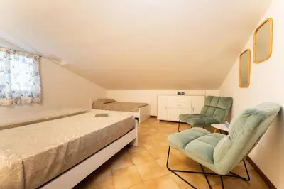 Letto o letti in una camera di Mansarda 7 Trilocale, Bafile241 - 2' Piano NO Ascensore - Adria Holiday Jesolo - FAMILY APARTMENT