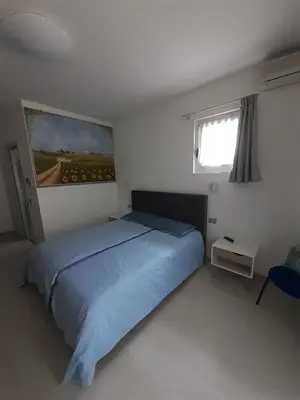 Letto o letti in una camera di Locazione turistica da Toio