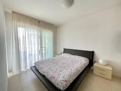 Letto o letti in una camera di Laguna - Carraro Immobiliare - Family Apartments