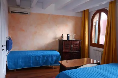 Letto o letti in una camera di Cà di Pizzo di Burano