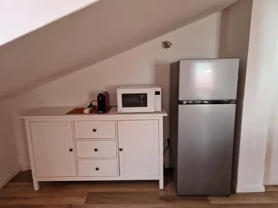 Cucina o angolo cottura di enJoy Home - Mansarda Piccolo Tesoro in centro città