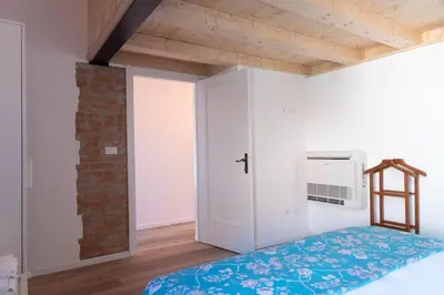 Letto o letti in una camera di enJoy Home - Mansarda Piccolo Tesoro in centro città