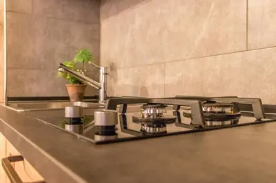 Cucina o angolo cottura di enJoy Home - Appartamento a due passi dal Teatro Verdi