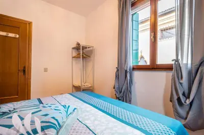 Letto o letti in una camera di enJoy Home - Appartamento a due passi dal Teatro Verdi