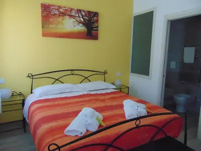Letto o letti in una camera di La stazione