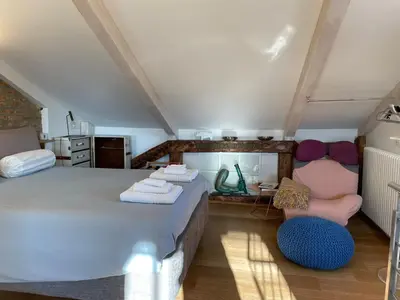 Letto o letti in una camera di Biennale Gallery Loft