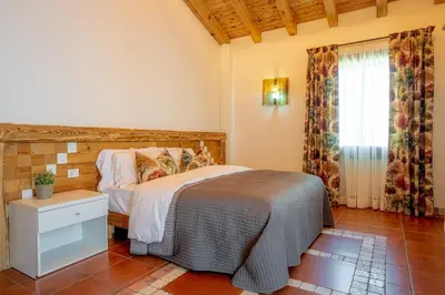 Letto o letti in una camera di GATTO IN VIGNA