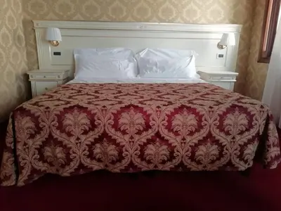 Letto o letti in una camera di CASA MARGOT