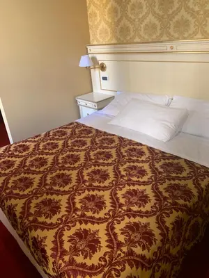 Letto o letti in una camera di CASA MARGOT