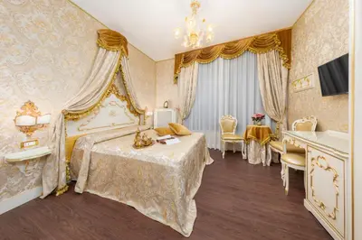 Letto o letti in una camera di La Veneziana Boutique Rooms