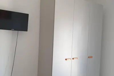 TV o dispositivi per l'intrattenimento presso RESIDENCE QUITO PIAZZA MAZZINI 150m dal mare e vicino Pista Azzurra
