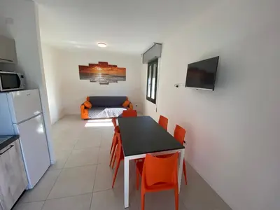 Cucina o angolo cottura di RESIDENCE QUITO PIAZZA MAZZINI 150m dal mare e vicino Pista Azzurra