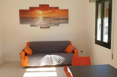 Area soggiorno di RESIDENCE QUITO PIAZZA MAZZINI 150m dal mare e vicino Pista Azzurra
