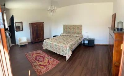 Letto o letti in una camera di Villa Iside
