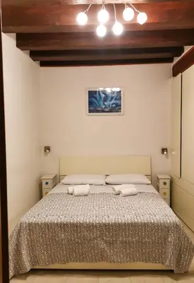 Letto o letti in una camera di Appartamento La Corte