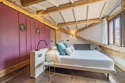 Letto o letti in una camera di Corte Rubbi 11 Secret Terrace Apartment