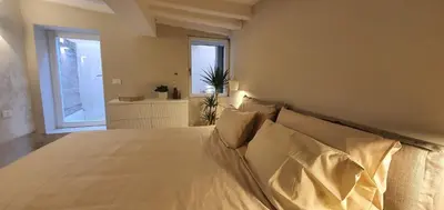 Letto o letti in una camera di Dimore del Borgo Antico - Corte da Lezze