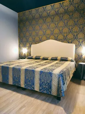 Letto o letti in una camera di LAERTE PALACE HOTEL