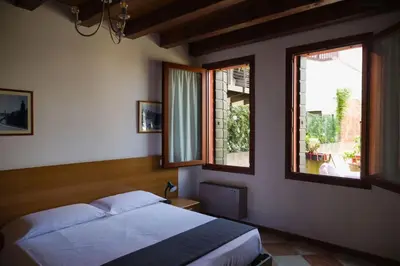 Letto o letti in una camera di Cornarorooms