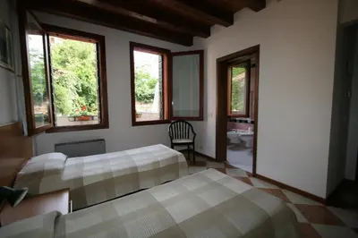 Letto o letti in una camera di Cornarorooms