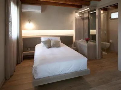 Letto o letti in una camera di Locanda MaMaGiò