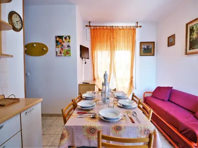 Area soggiorno di Nice holiday home in Rosolina Mare with a terrace