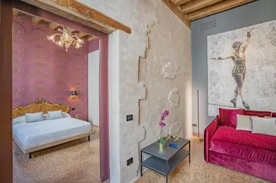 Letto o letti in una camera di Corte Rubbi 7 Deluxe Apartment
