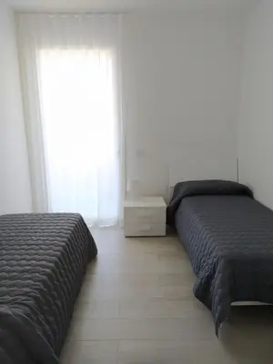 Letto o letti in una camera di Jesolo Appartamenti F2 - Green Viking