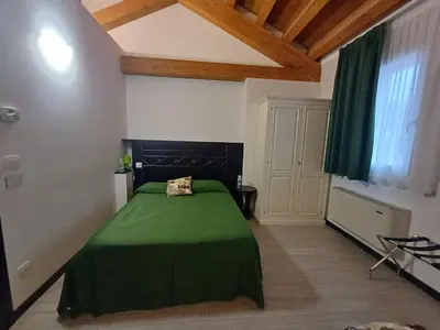 Letto o letti in una camera di Arneroni
