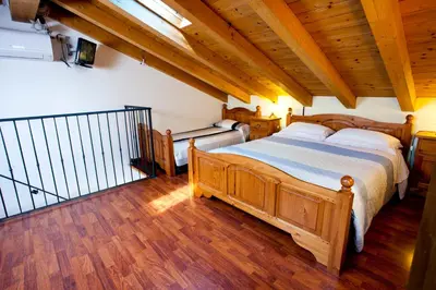 Letto o letti in una camera di Locazioni Turistiche By Max