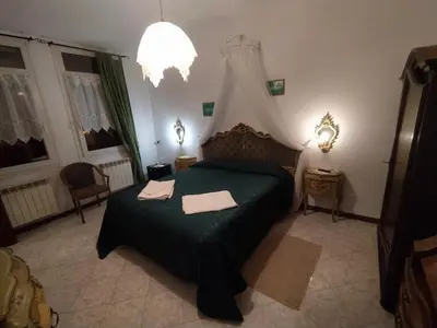 Letto o letti in una camera di Cà Isabella