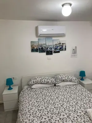Letto o letti in una camera di Venezia, 15 minutes from Venice, Parking,Shuttle airport, Train station Bellini