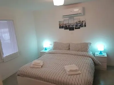Letto o letti in una camera di Venezia, 15 minutes from Venice, Parking,Shuttle airport, Train station Bellini