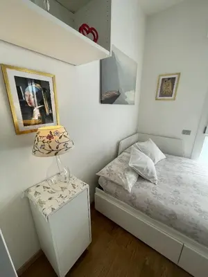 Letto o letti in una camera di A UN PASSO DALL'OSPEDALE