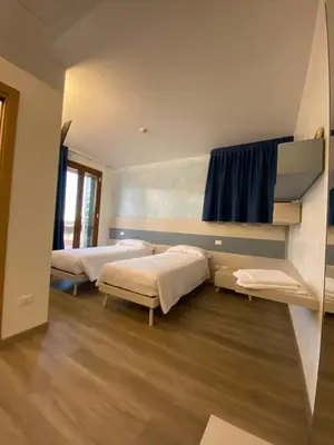 Letto o letti in una camera di Casa Nostra
